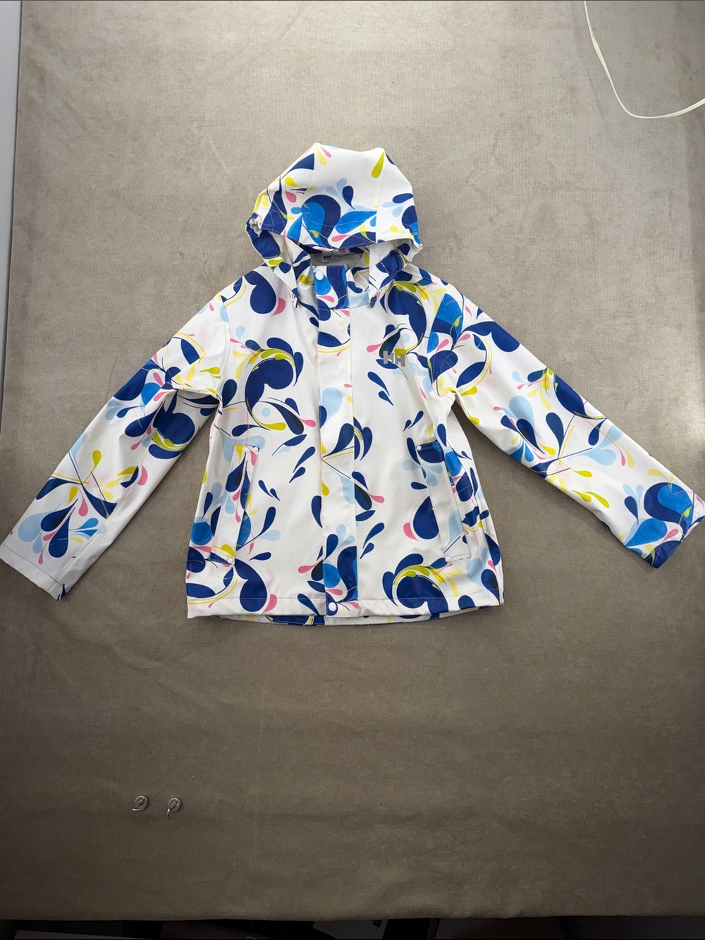Helly Hansen White Kids Raincoat with Blue, Yellow & Pink Splash Pattern